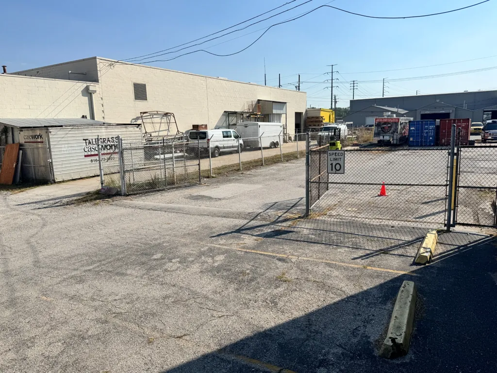 Enter the back parking lot behind the building